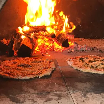 Mastering Pizza Perfection: Making Pizza In A Wood-fired Oven